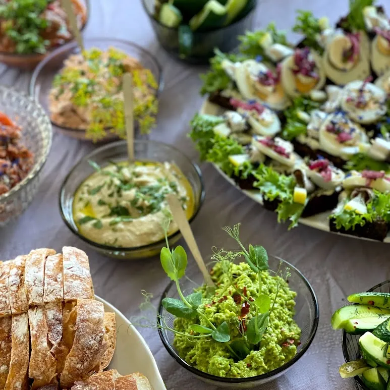 Bread, homemade spreads and canapés served on linen